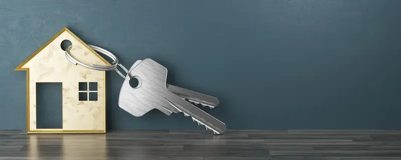 Image of a house with keys attached to it, representing the concept of keeping your house during bankruptcy.