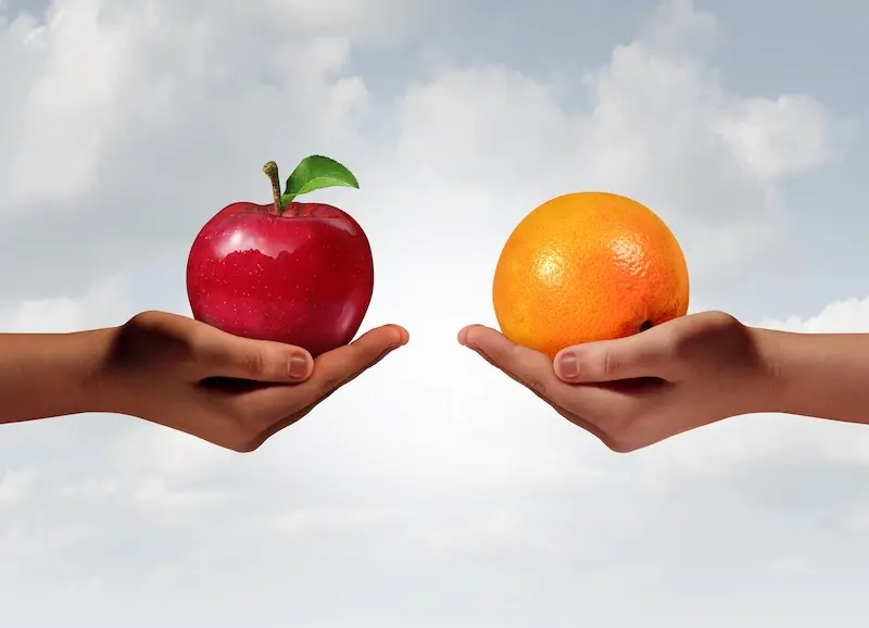 Apples and oranges used as a visual metaphor for comparing two bankruptcy options.