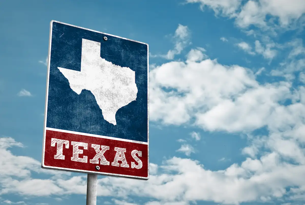 Texas road sign at sunset